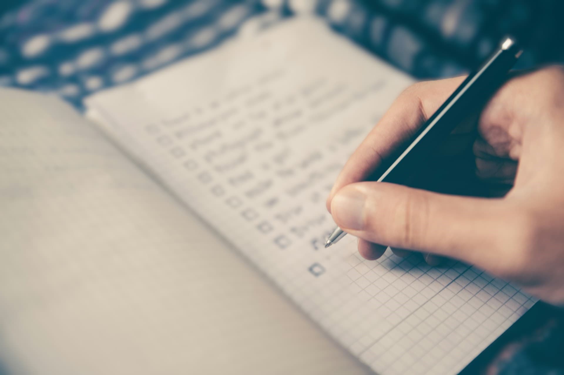 Person making a list of their relationship needs and wants.